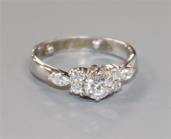 A modern 18ct white gold and single stone diamond ring, with diamond set shoulders, size M.